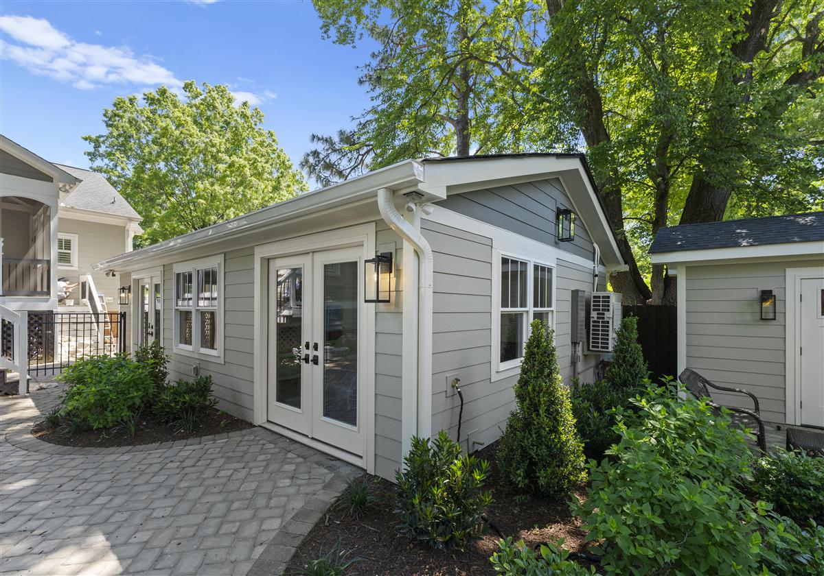 Guest studio with French doors and a paver walkway, Charlotte ADU and garage rebuild