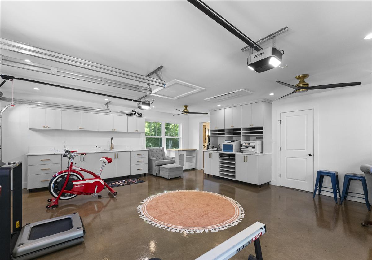 Home gym with a stationary bike and built-in storage, Charlotte ADU