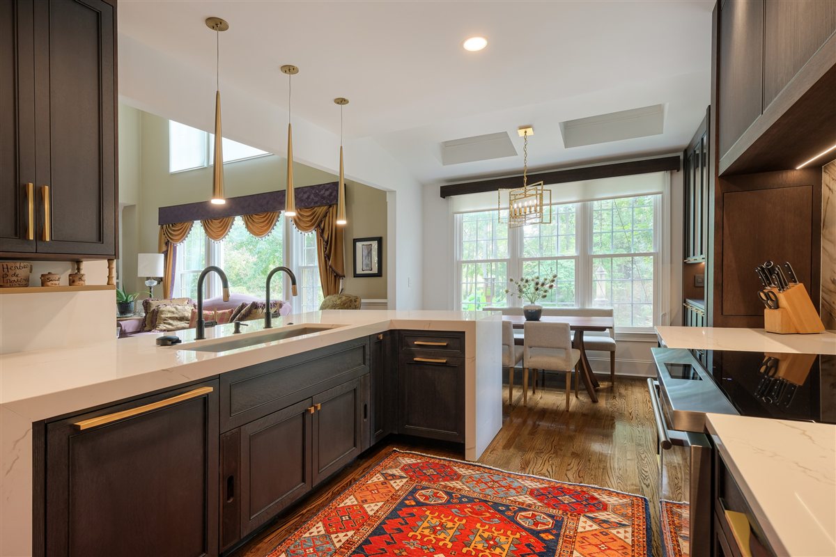 Peninsula with dark cabinetry looking into the breakfast room, Charlotte chef's kitchen