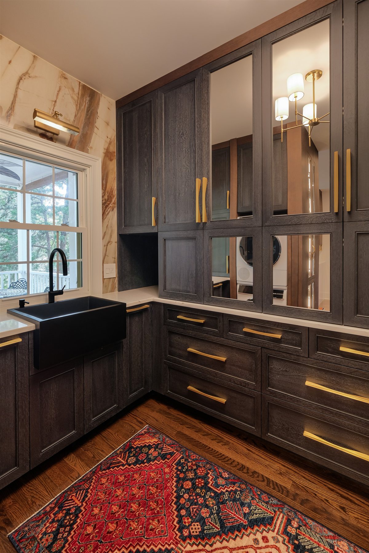 Scullery with a black sink under the window and dark cabinetry, Charlotte chef's kitchen