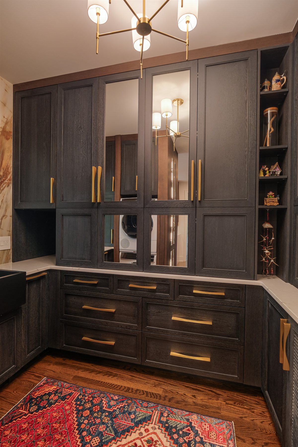 Scullery wall with glass-front cabinets and a sputnik chandelier, Charlotte chef's kitchen
