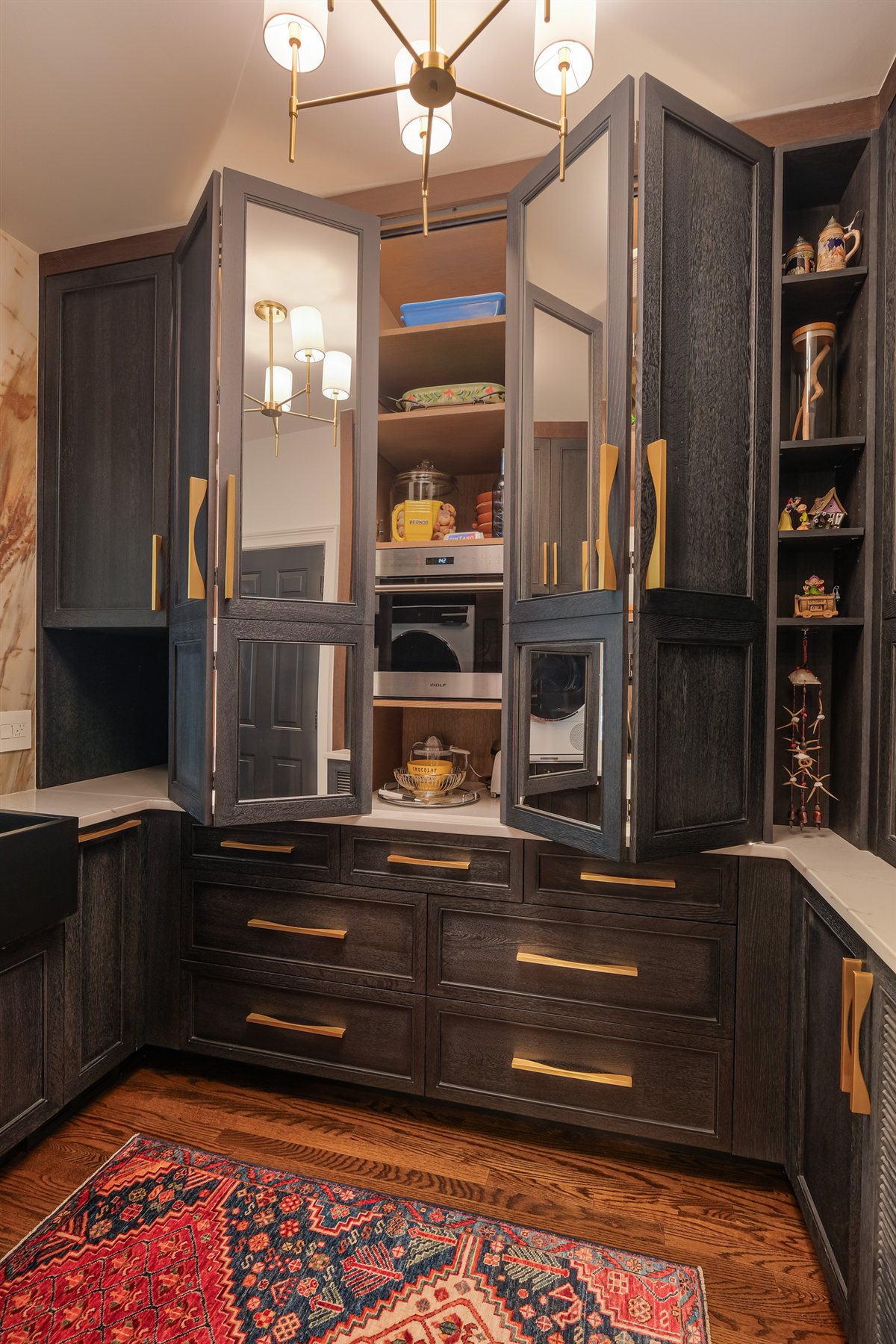 Appliance cabinet with bifold doors open to a lit coffee station, Charlotte chef's kitchen