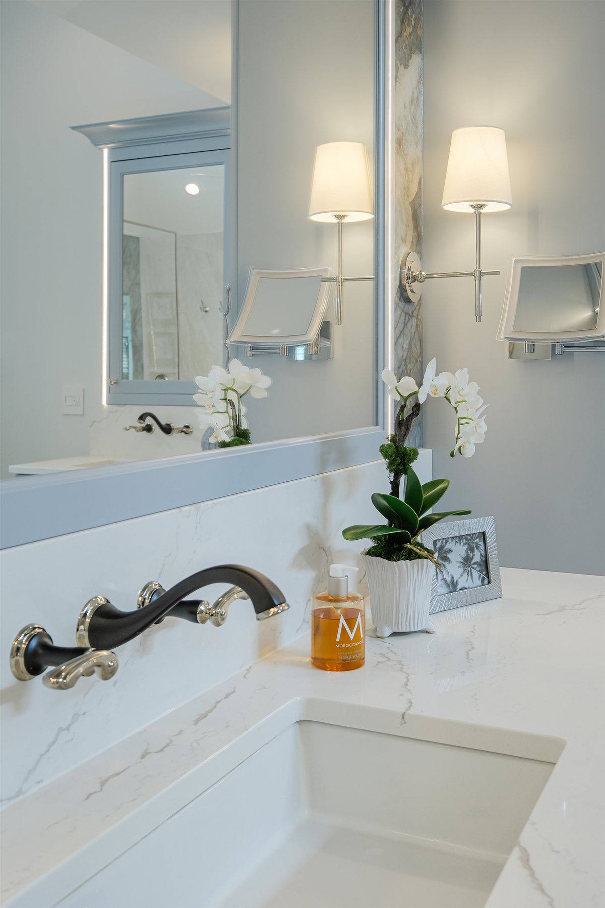 Wall-mounted faucet at the vanity sink, Charlotte spa bath