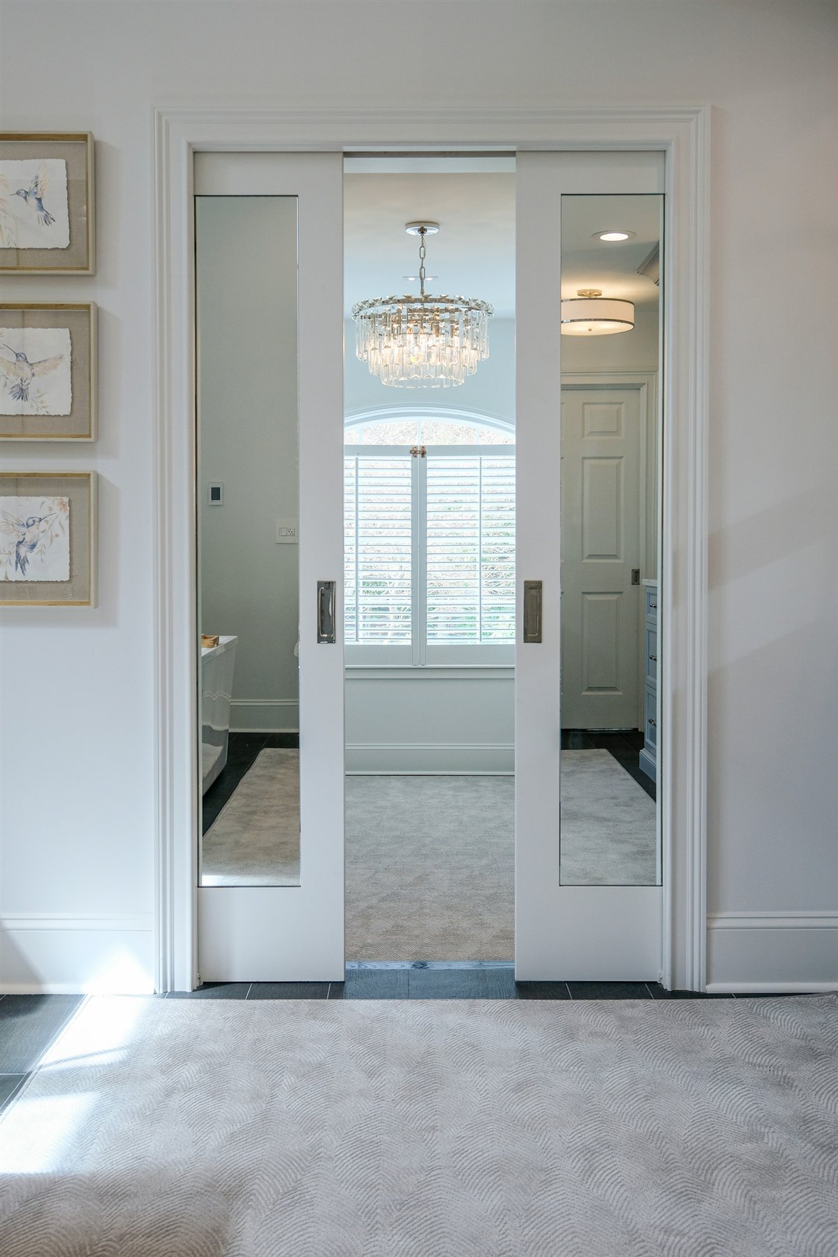 Glass doors into the primary closet, Charlotte spa bath