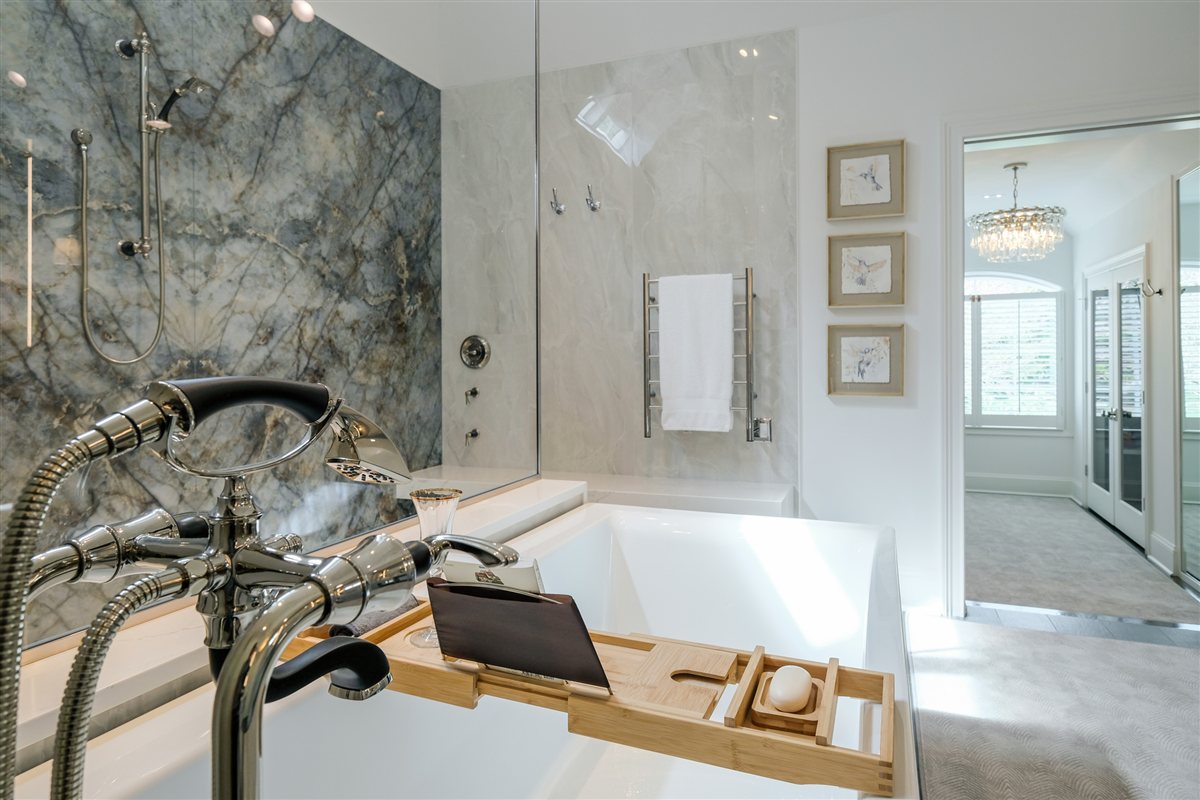 Floor-mounted tub filler and porcelain slab shower wall, Charlotte spa bath