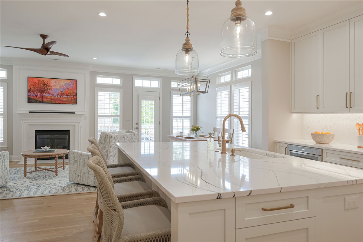 Kitchen island looking toward the quartz-faced fireplace, Peninsula townhouse kitchen