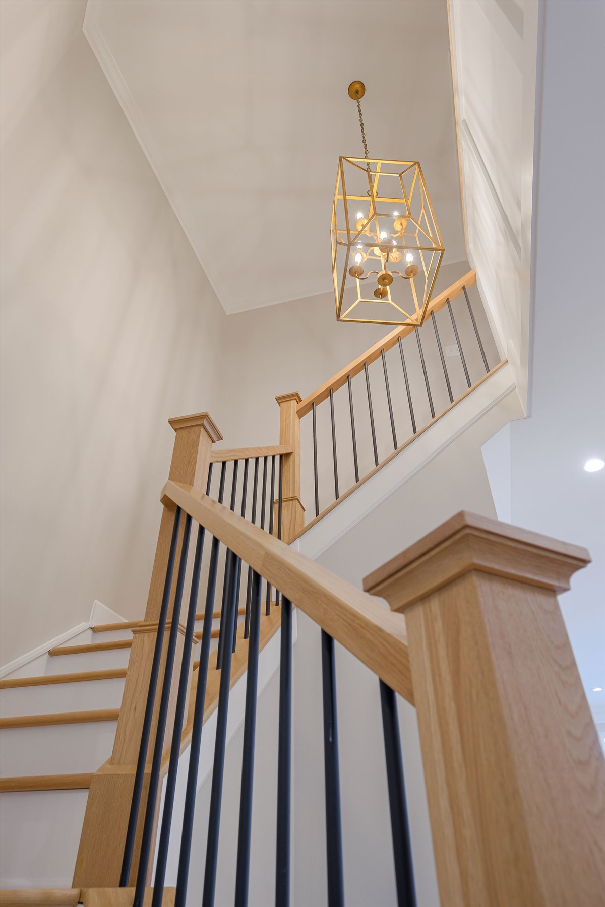 Stair with oak treads, black balusters and a brass lantern, Peninsula townhouse renovation