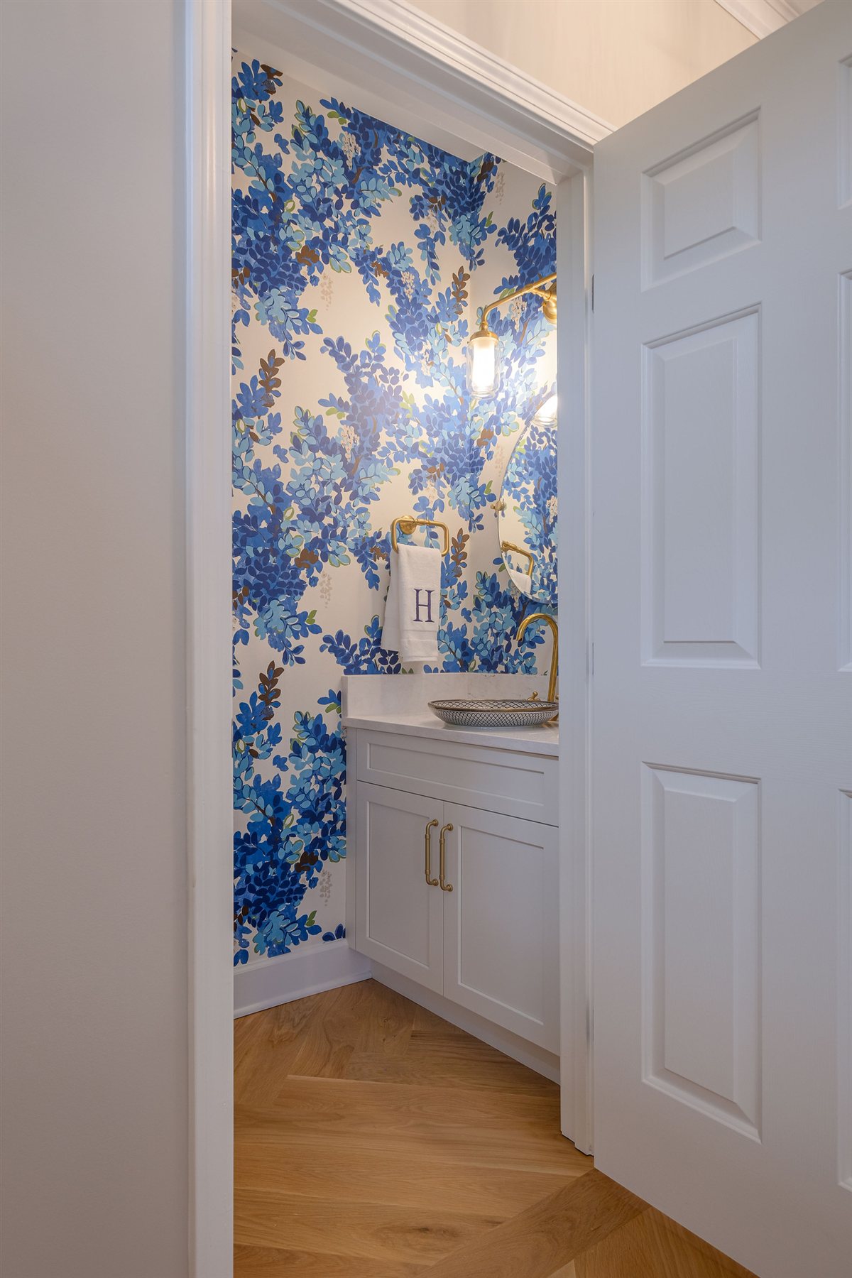 Doorway beside blue floral wallpaper, Peninsula townhouse renovation