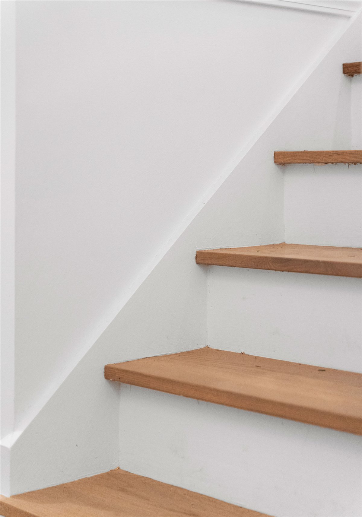 White stair risers with oak treads, River Chase renovation