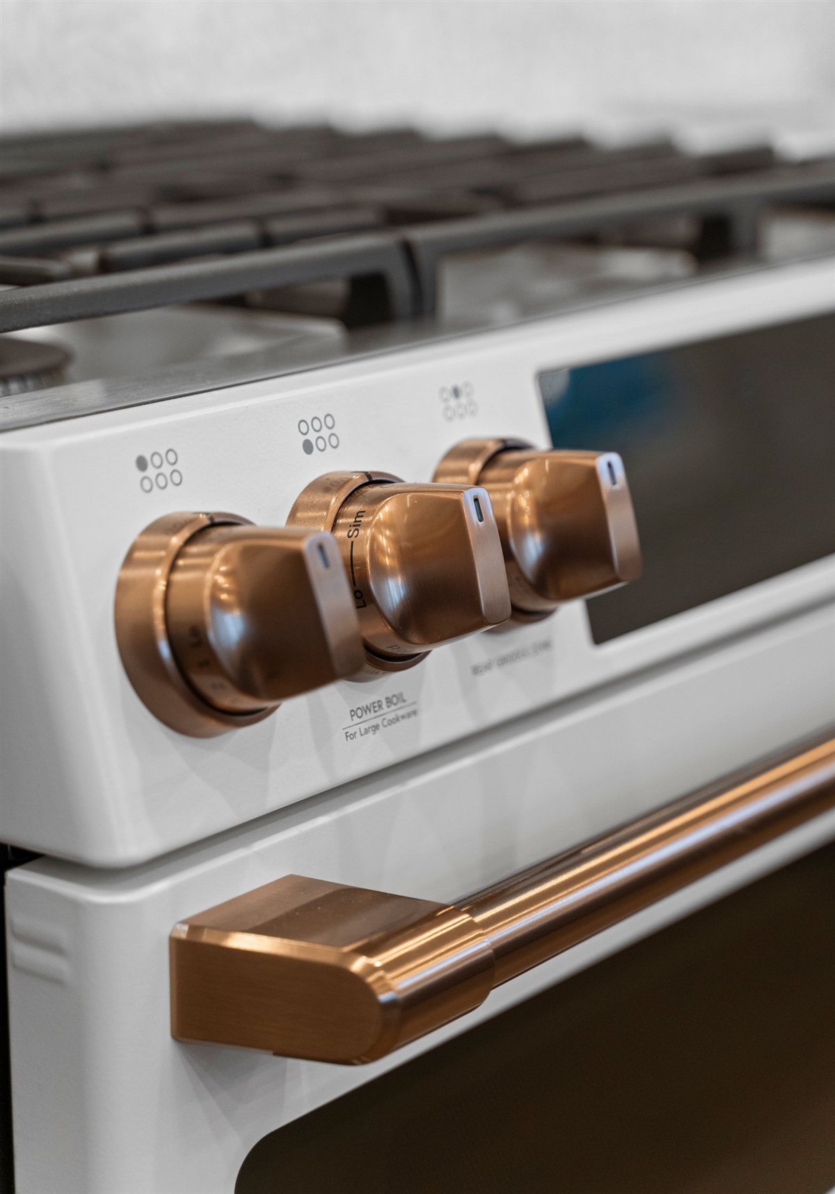 White range knobs with copper accents, River Chase kitchen