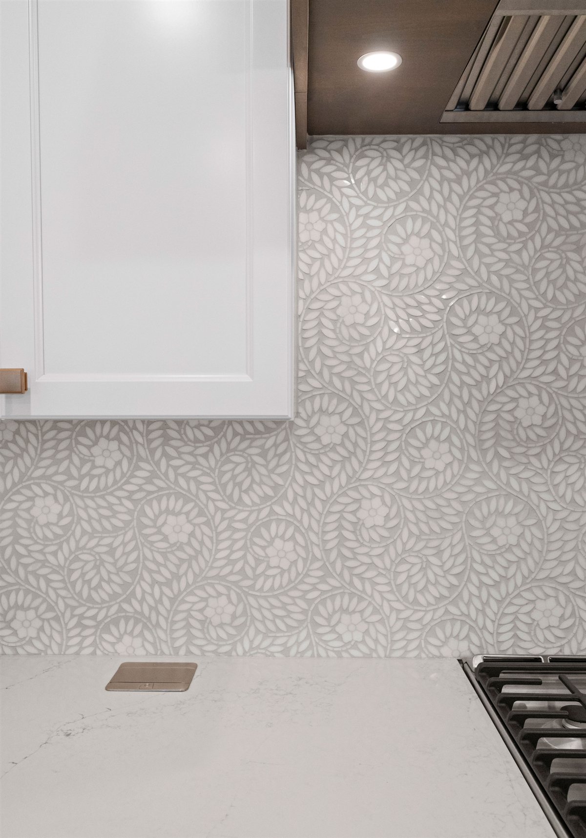 Patterned tile backsplash beside the range, River Chase kitchen
