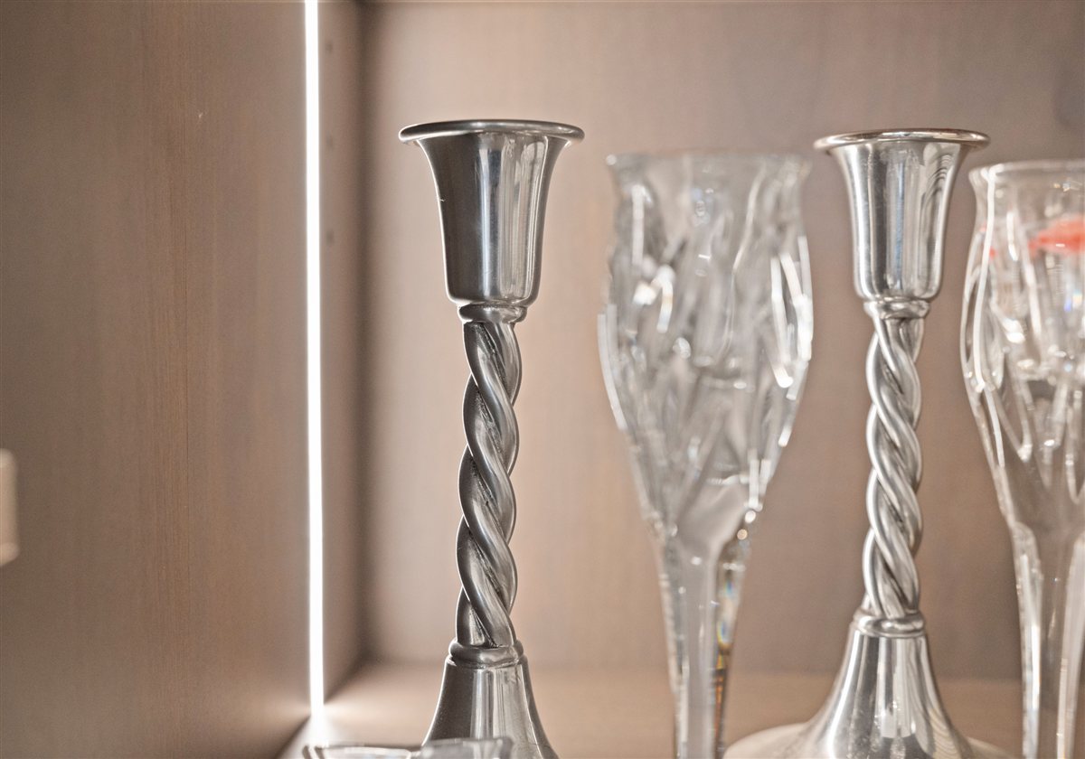 Glassware on a lit shelf, River Chase kitchen