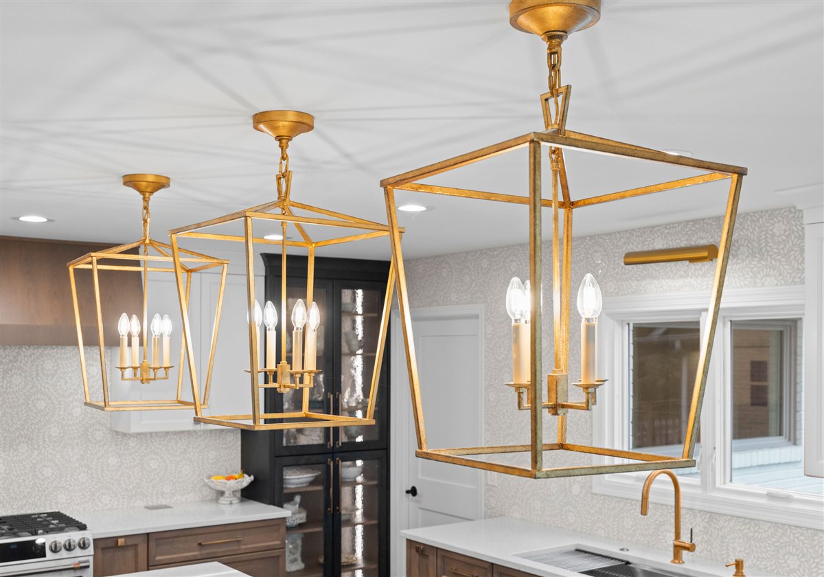 Three brass lantern pendants over the island, River Chase kitchen