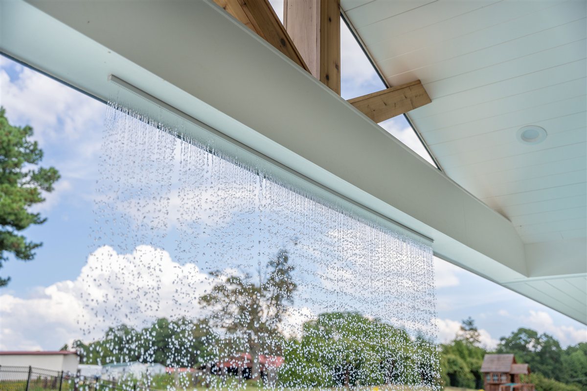 Rain curtain falling from the porch roof, Denver outdoor living