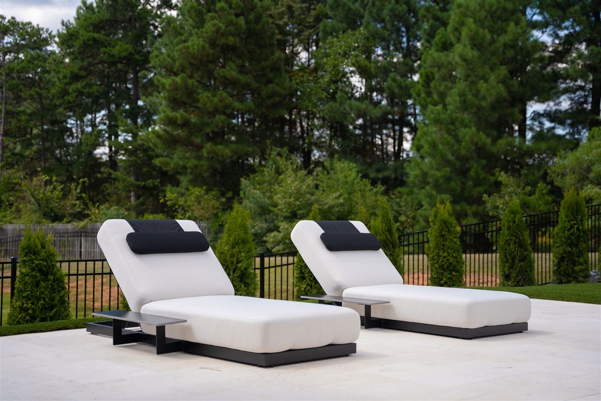 Chaise loungers on the white travertine pool deck, Denver outdoor living