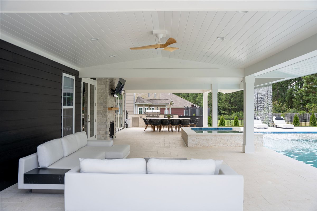 Outdoor living room with an L-shaped sofa and ceiling fan, Denver outdoor living