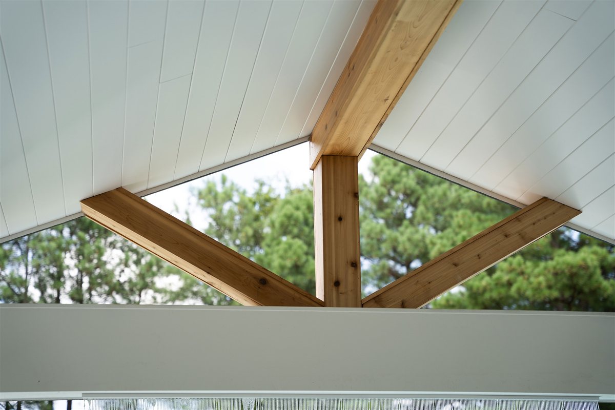 Exposed timber brackets in the porch gable, Denver outdoor living