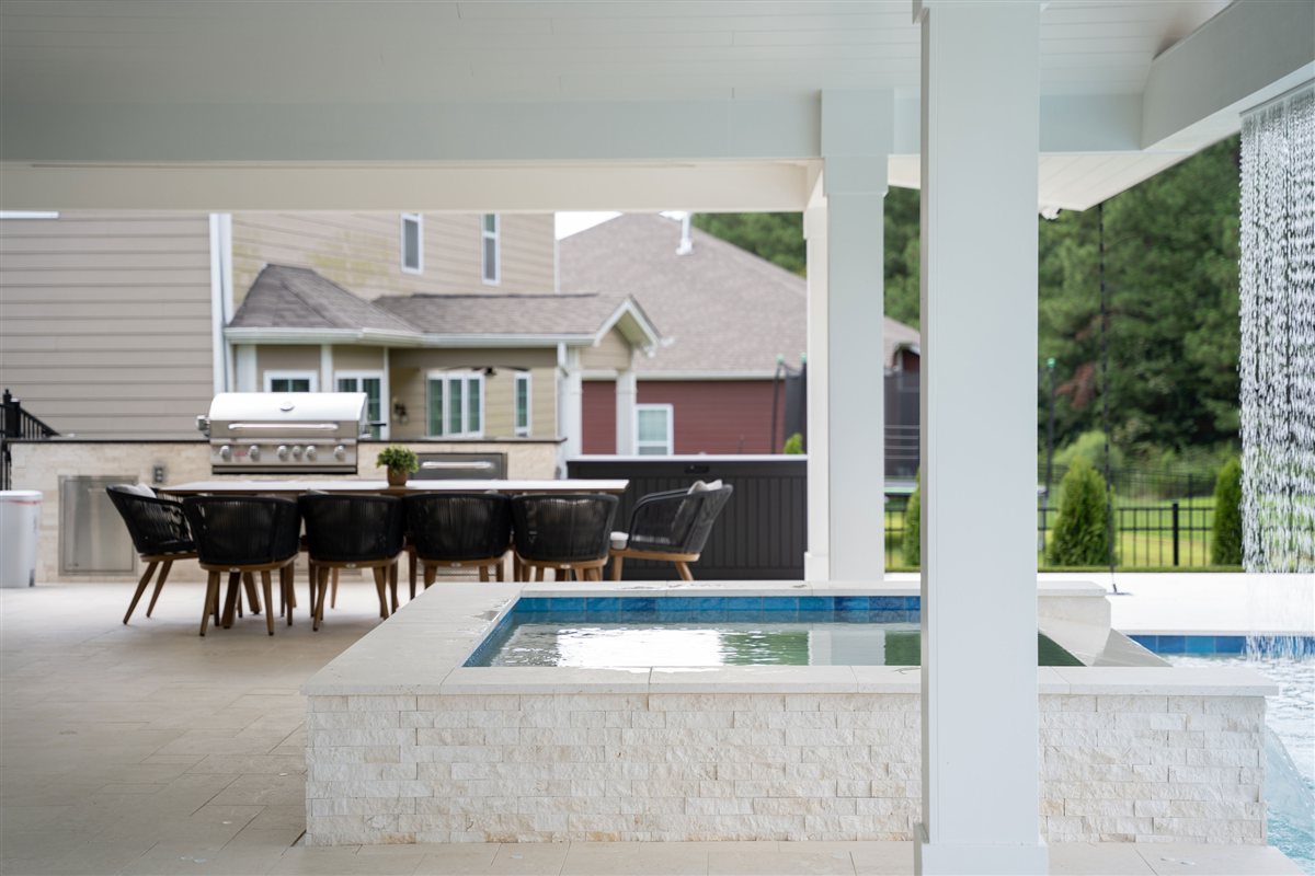Outdoor kitchen and dining area beside the spa, Denver outdoor living