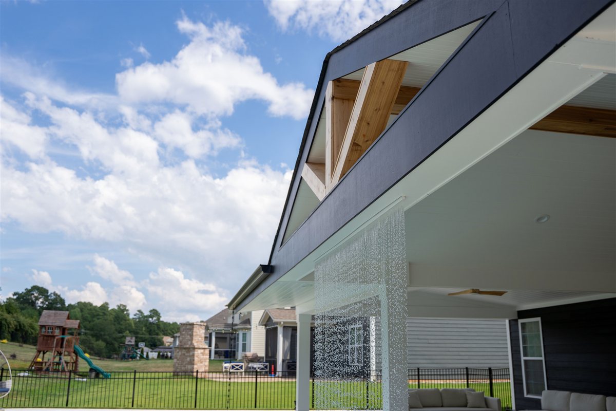Porch roofline with timber gable against the sky, Denver outdoor living