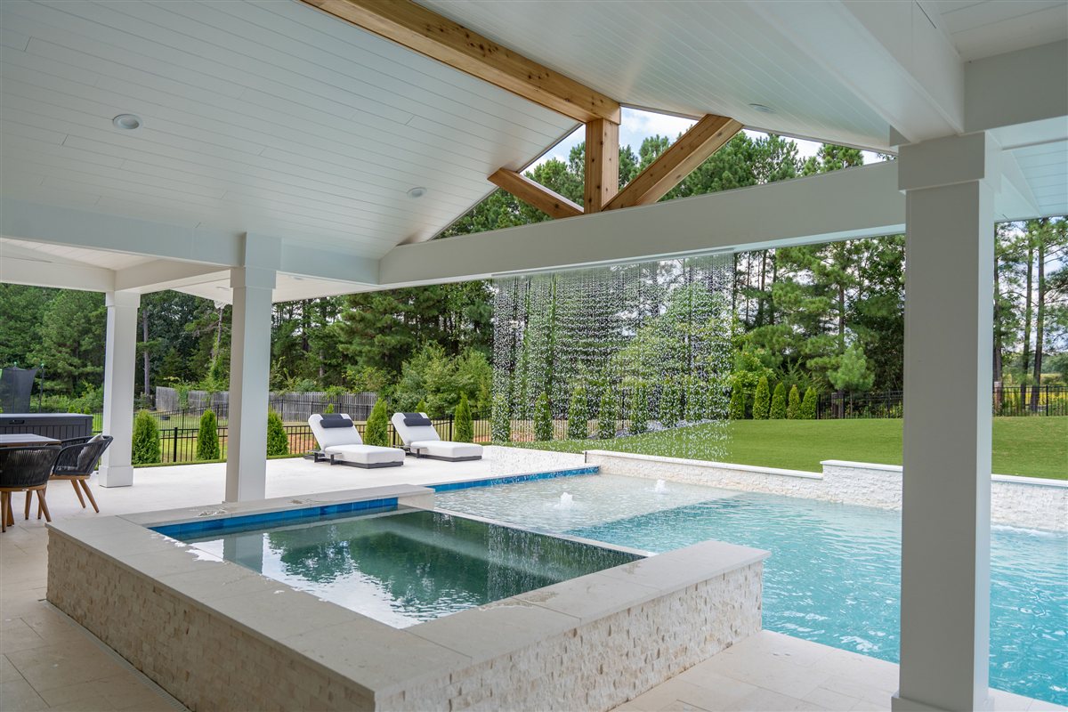 Raised spa and pool from under the porch, Denver outdoor living
