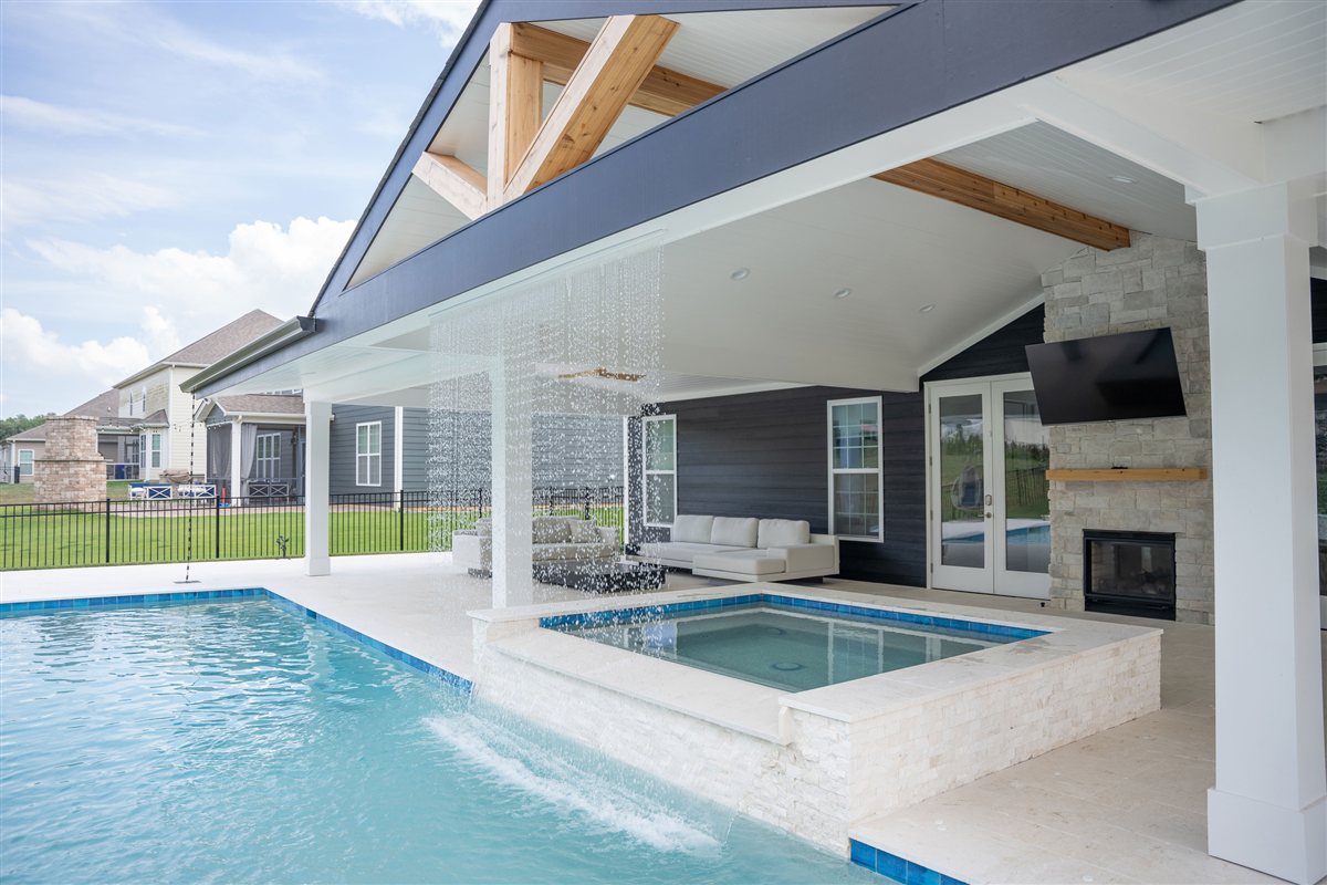 Rain curtain falling from the porch roof into the pool, Denver outdoor living