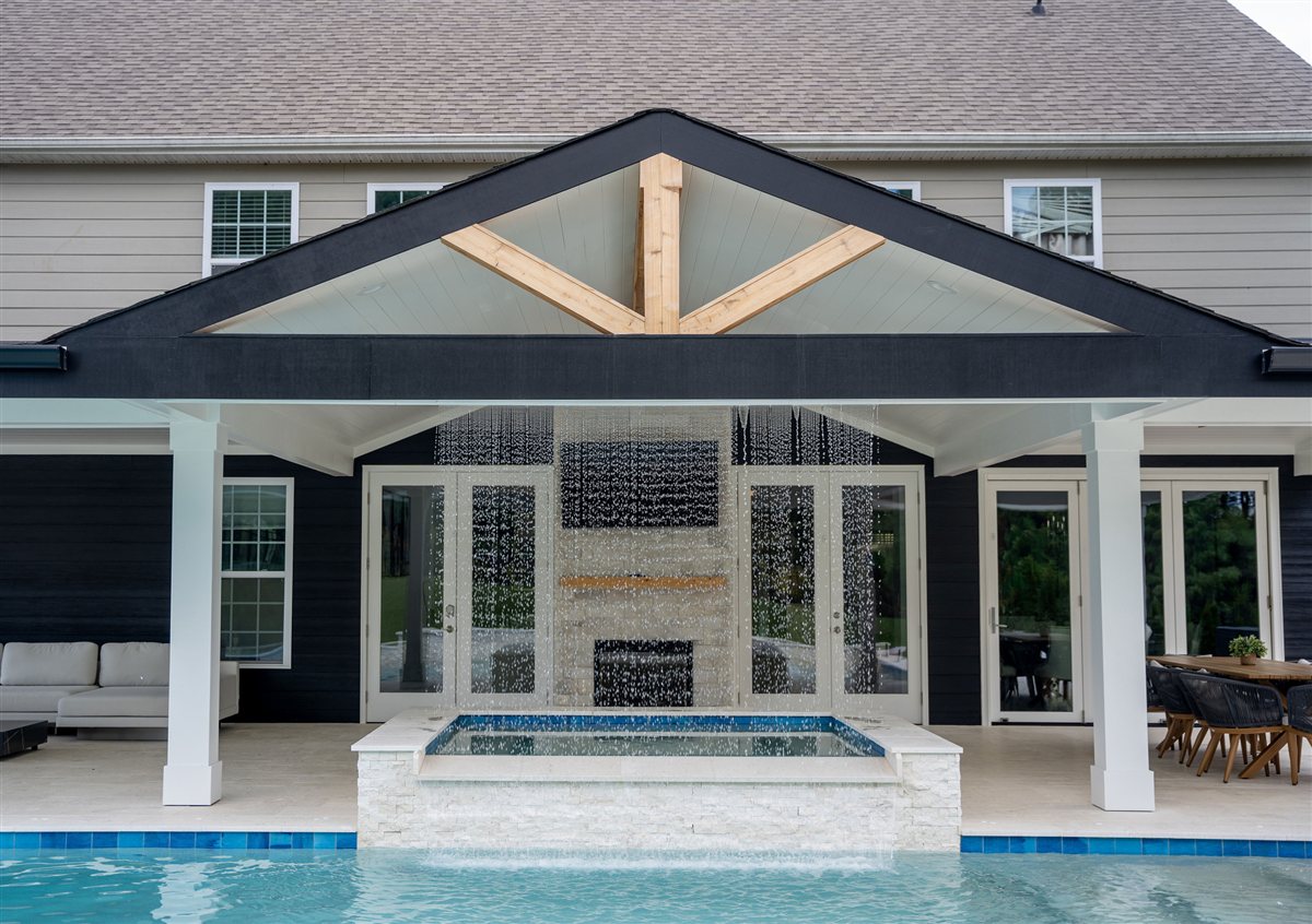 Covered porch with exposed timber gable above the spa, Denver outdoor living
