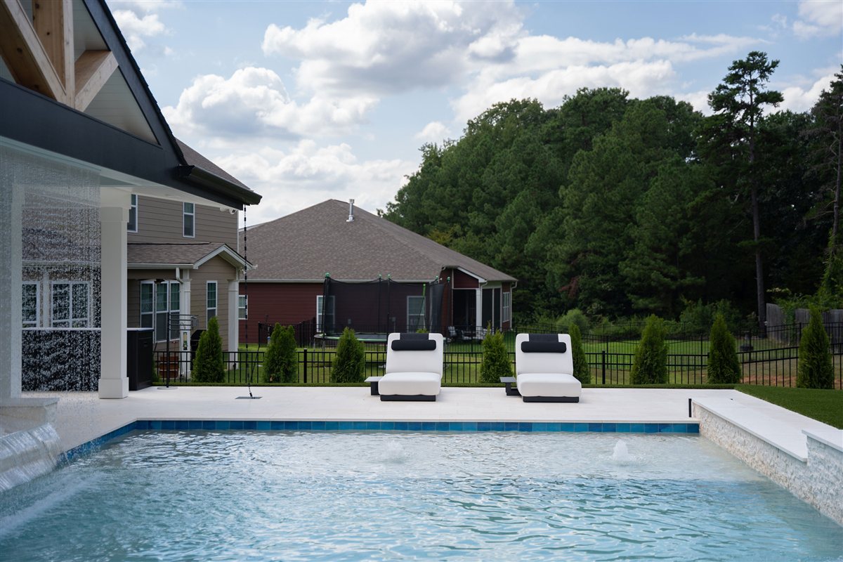 Pool and loungers beside the covered porch, Denver outdoor living