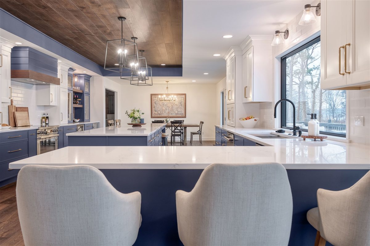 Island seating with upholstered chairs, Moss Lake kitchen