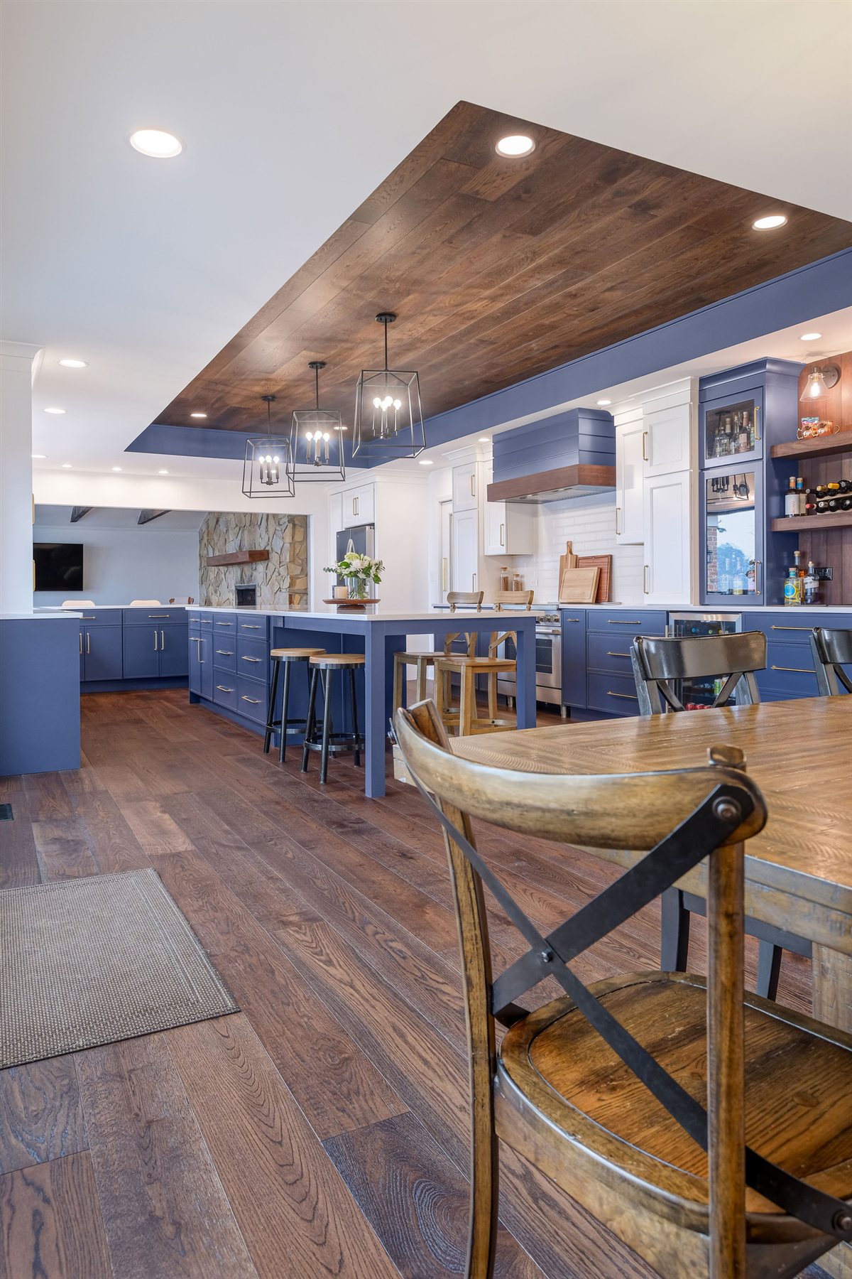Kitchen with a wood ceiling panel and blue island, Moss Lake kitchen