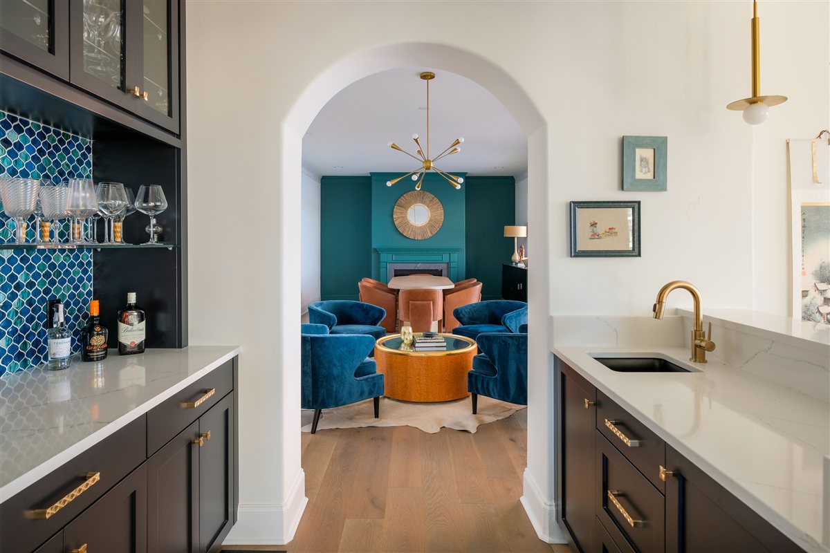 Arched doorway into a teal sitting room with a blue tile bar, Lake Wylie kitchen and outdoor deck project