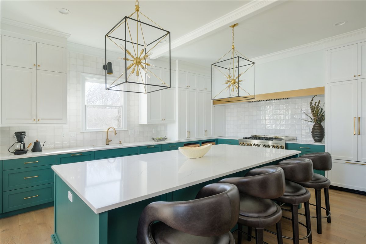 Teal island with leather stools under geometric brass pendants, Lake Wylie kitchen