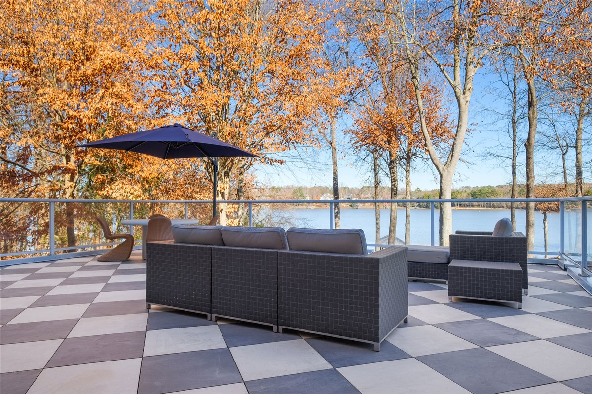 Lakefront deck with outdoor sofas and a blue umbrella, Lake Wylie outdoor deck