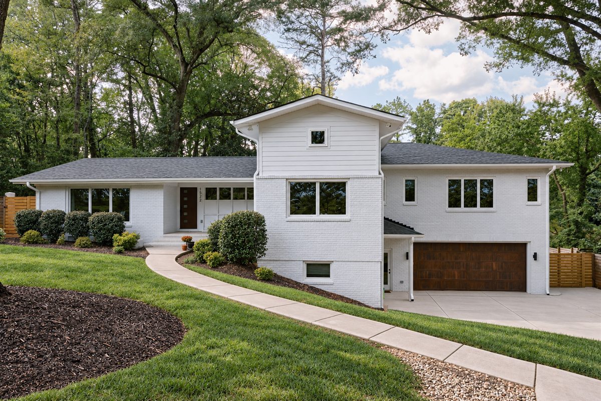 1953 brick house painted white with a new two-story addition and garage, Lansdowne, Charlotte, by Revival Construction