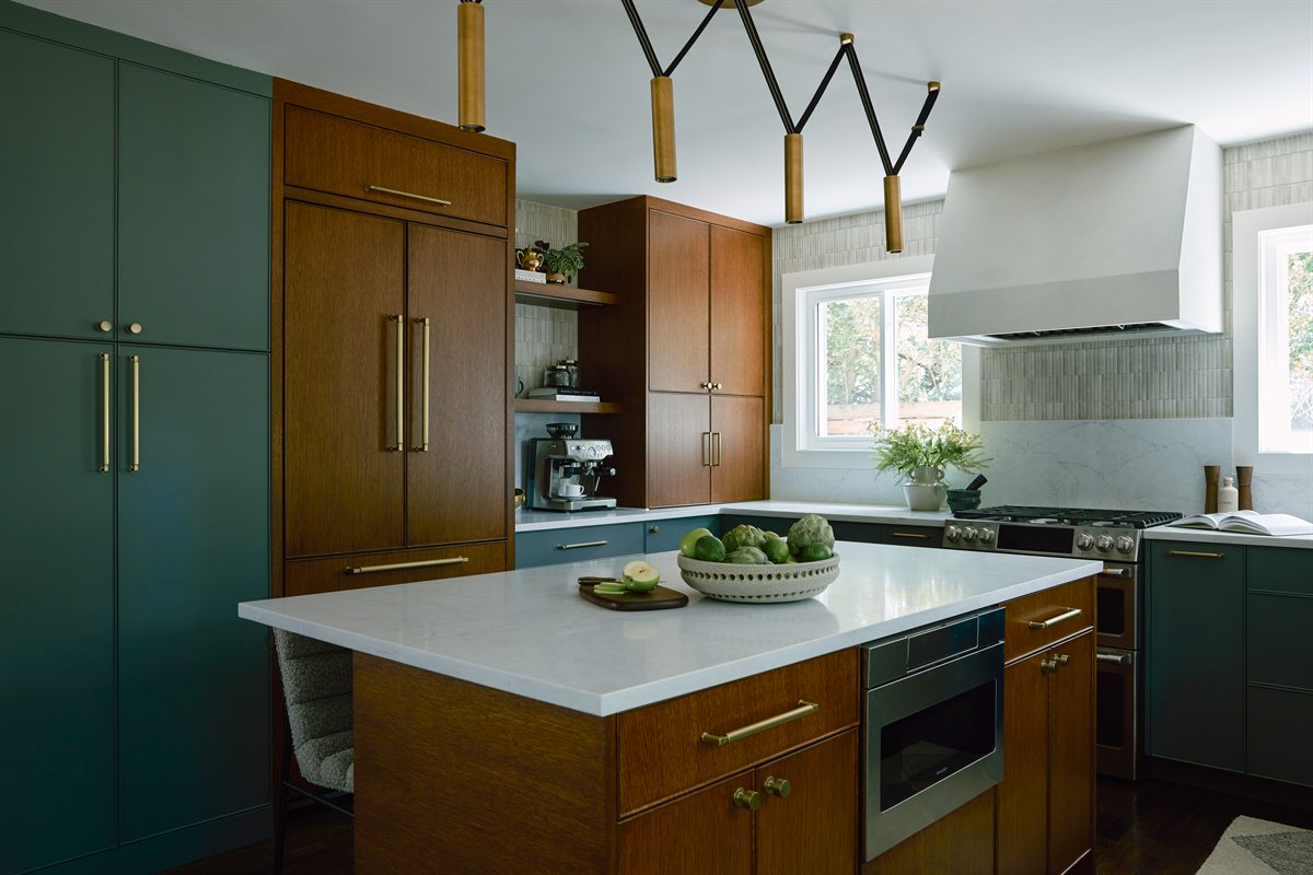 Kitchen island and tall pantry wall in deep green and warm wood, Lansdowne kitchen renovation, Charlotte