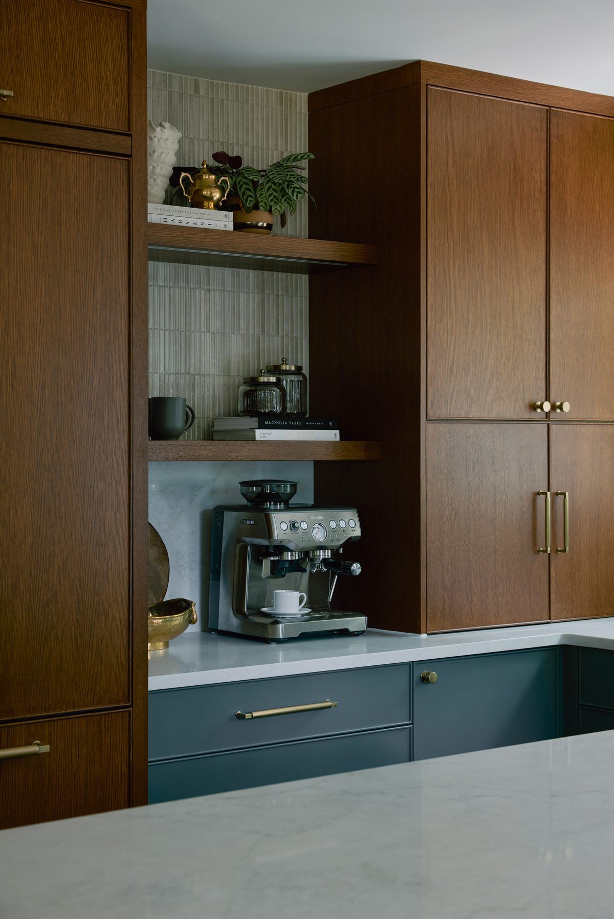 Coffee station between tall warm wood cabinets over green base cabinetry, Lansdowne kitchen, Charlotte