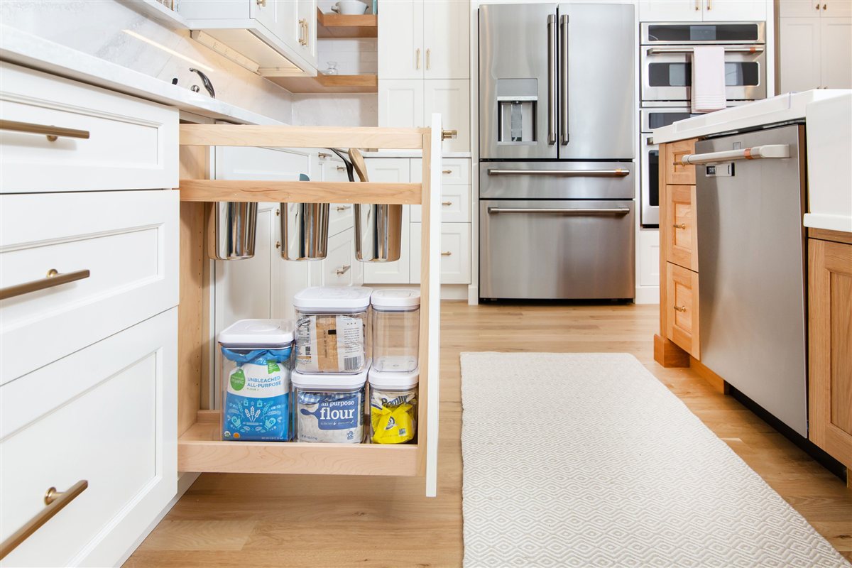 Pull-out pantry organizer beside the refrigerator, Monroe kitchen
