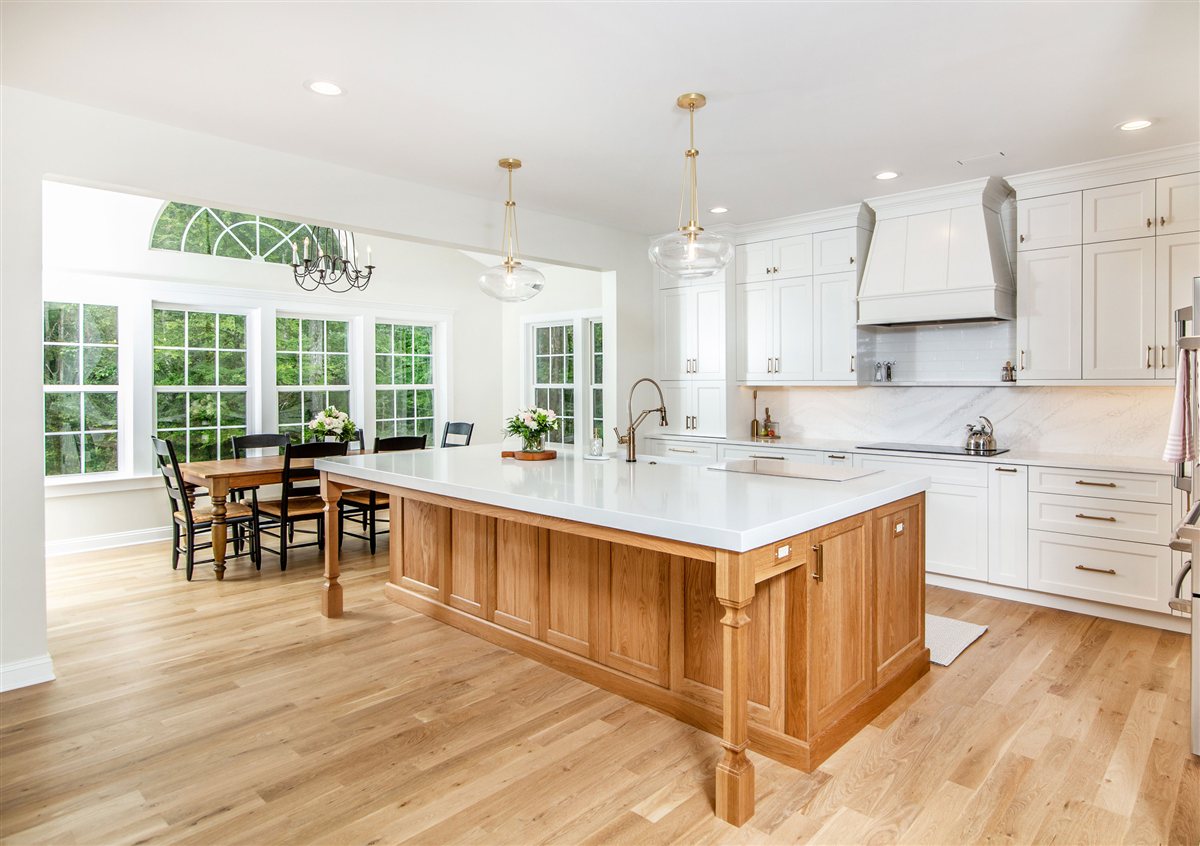 Wood island facing a wall of windows, Monroe kitchen