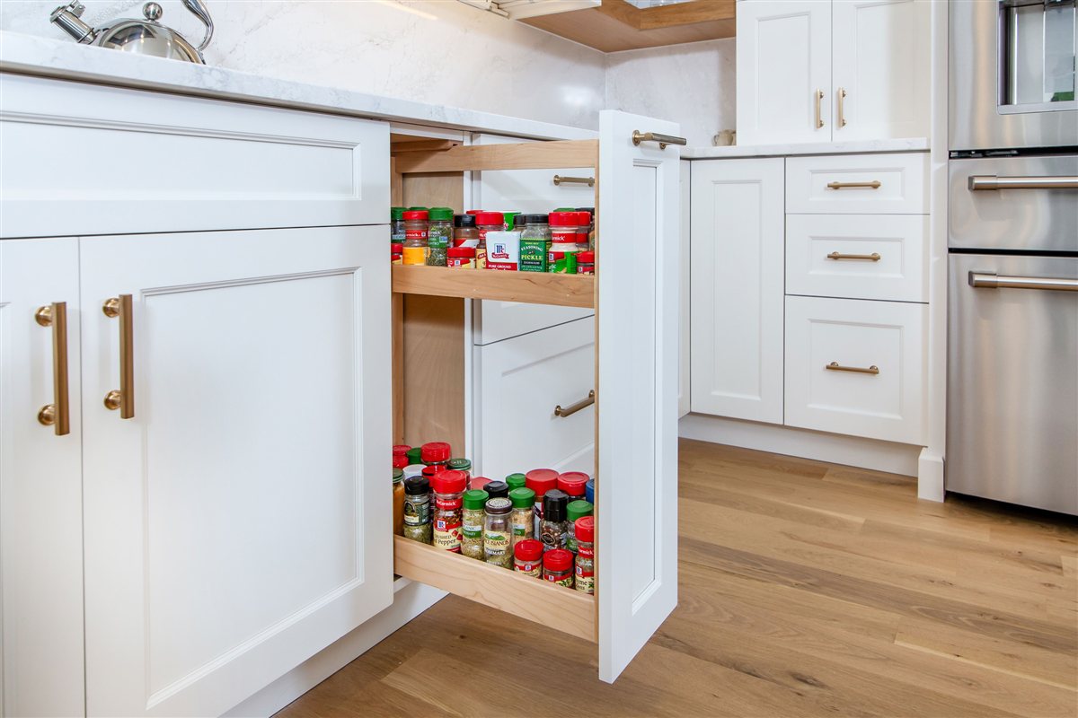 Pull-out spice rack beside the drawer stack, Monroe kitchen