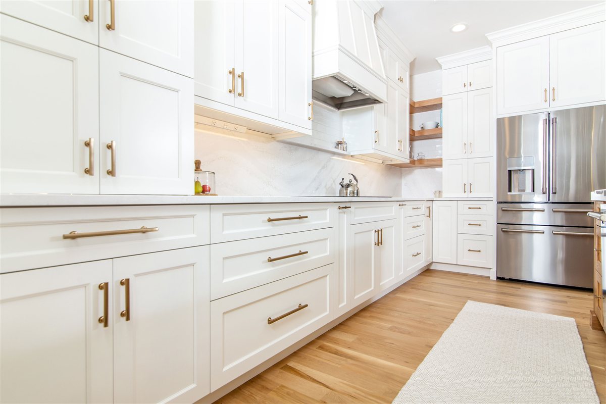 White cabinetry run with stainless appliances, Monroe kitchen
