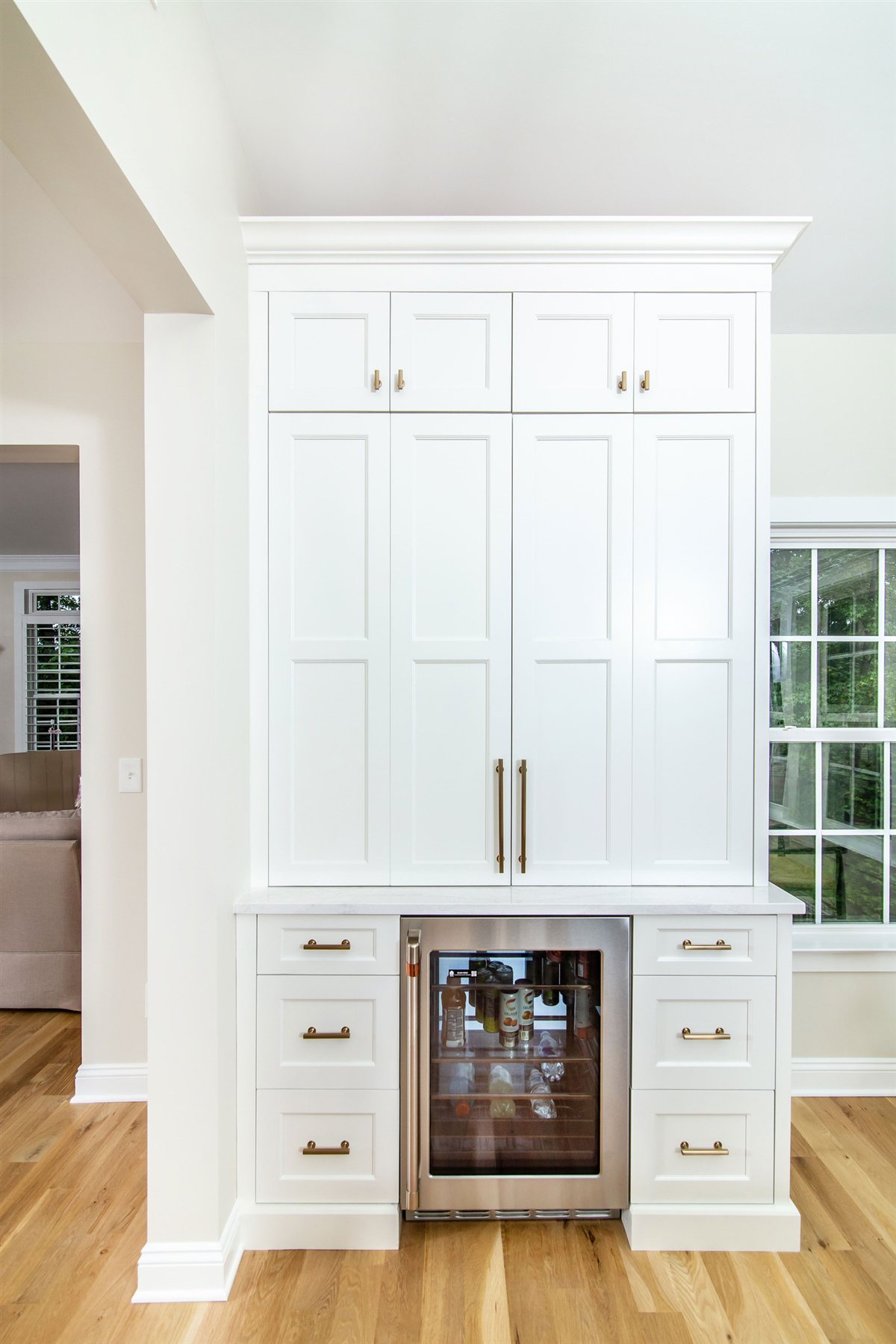 Tall white cabinet with a beverage fridge, Monroe kitchen