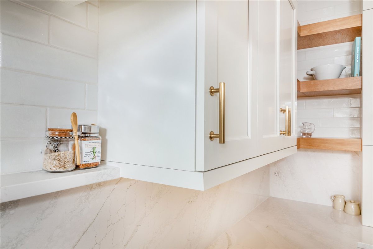 White cabinetry with open wood shelves and a tile backsplash, Monroe kitchen