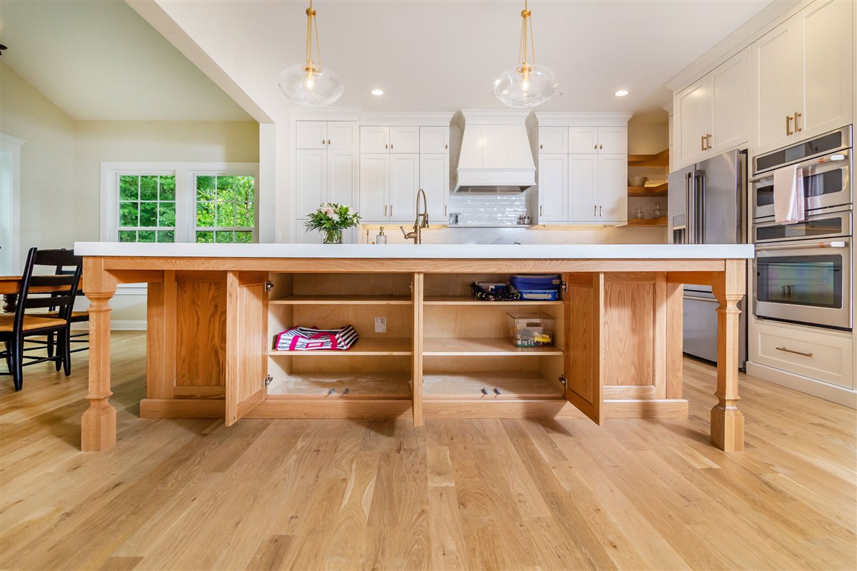 Wood island with open shelving at the dining end, Monroe kitchen