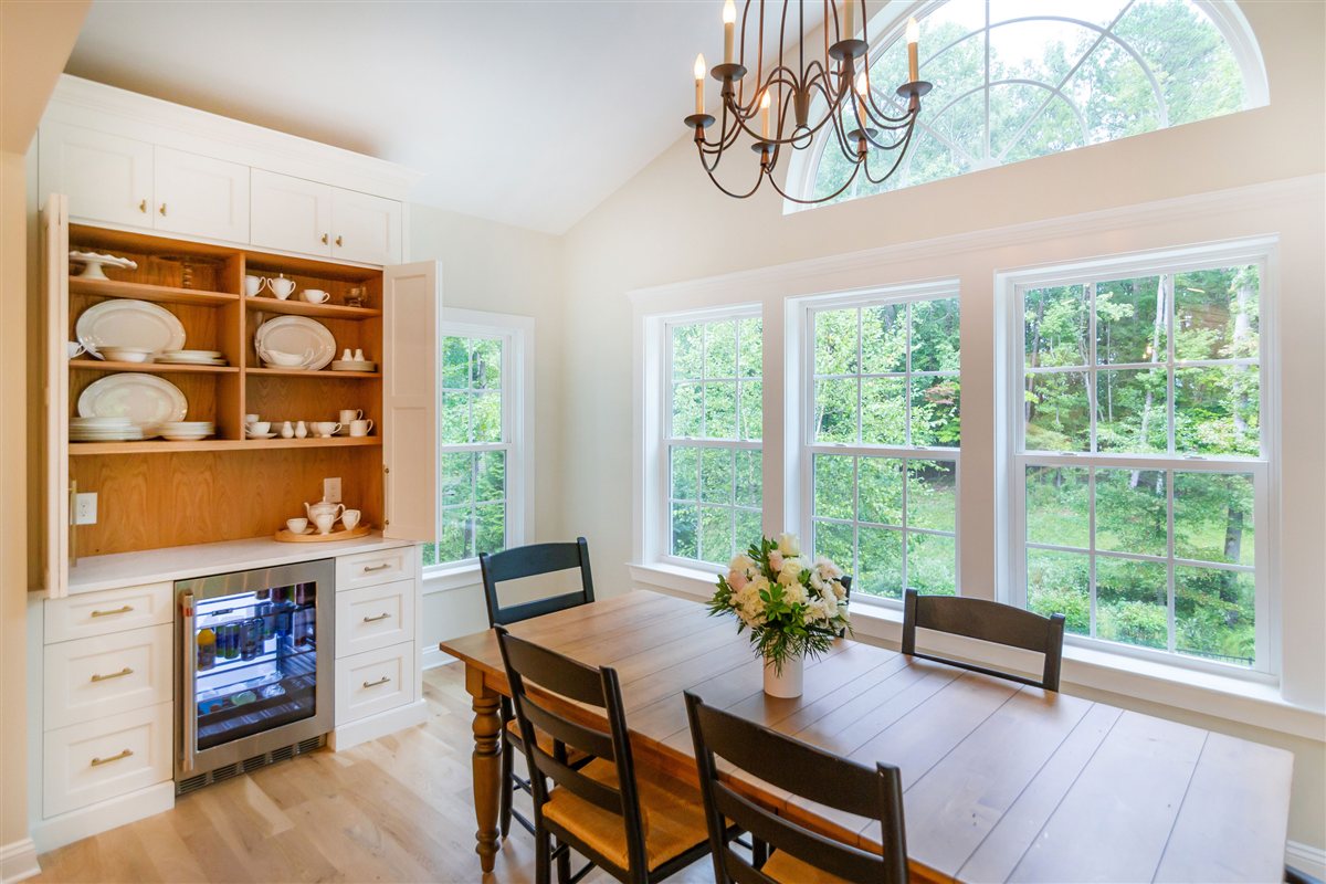 Dining area with a built-in hutch and a wall of windows, Monroe kitchen