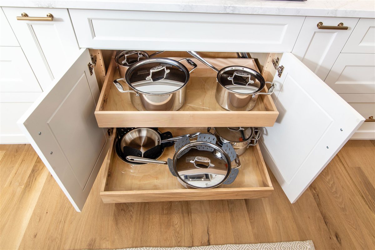 Roll-out pan storage in white cabinetry, Monroe kitchen