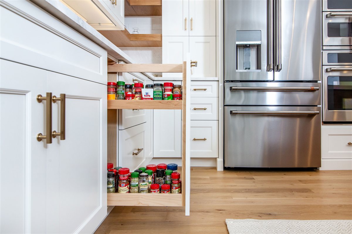 Pull-out spice rack beside the refrigerator, Monroe kitchen