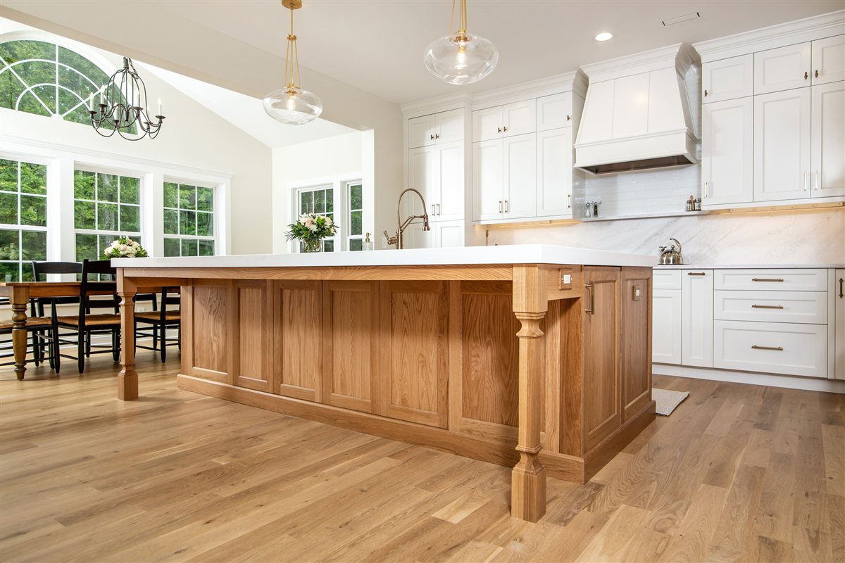 Wood island and dining area with arched windows, Monroe kitchen