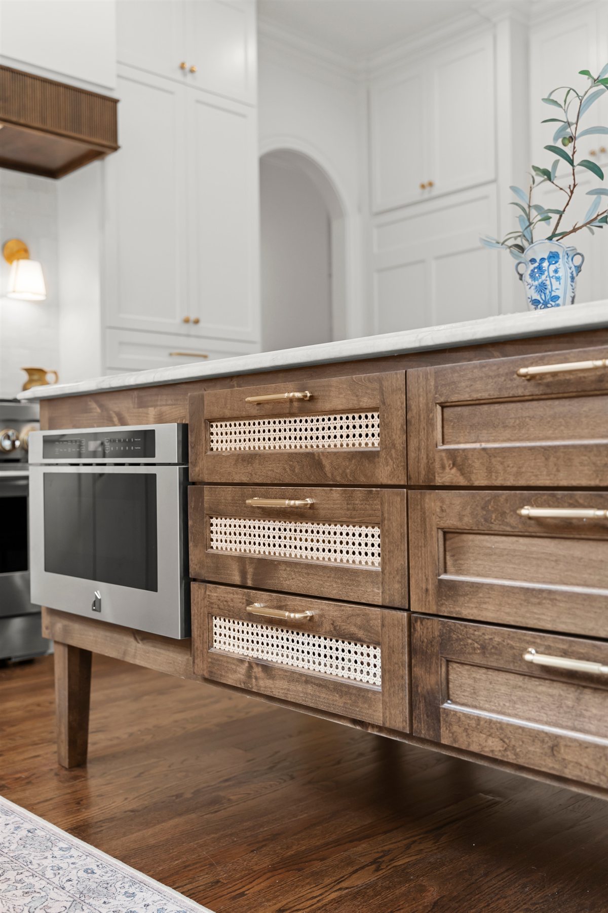 Dark wood island with drawers and a built-in microwave, The Point renovation