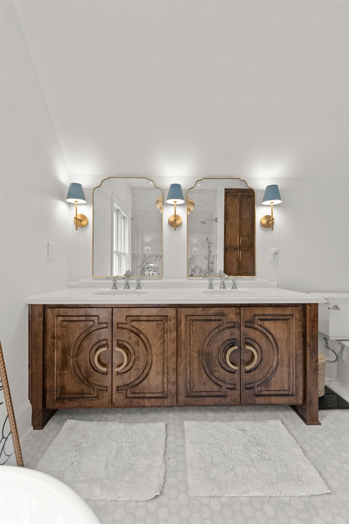 Carved wood double vanity with arched mirrors, The Point renovation