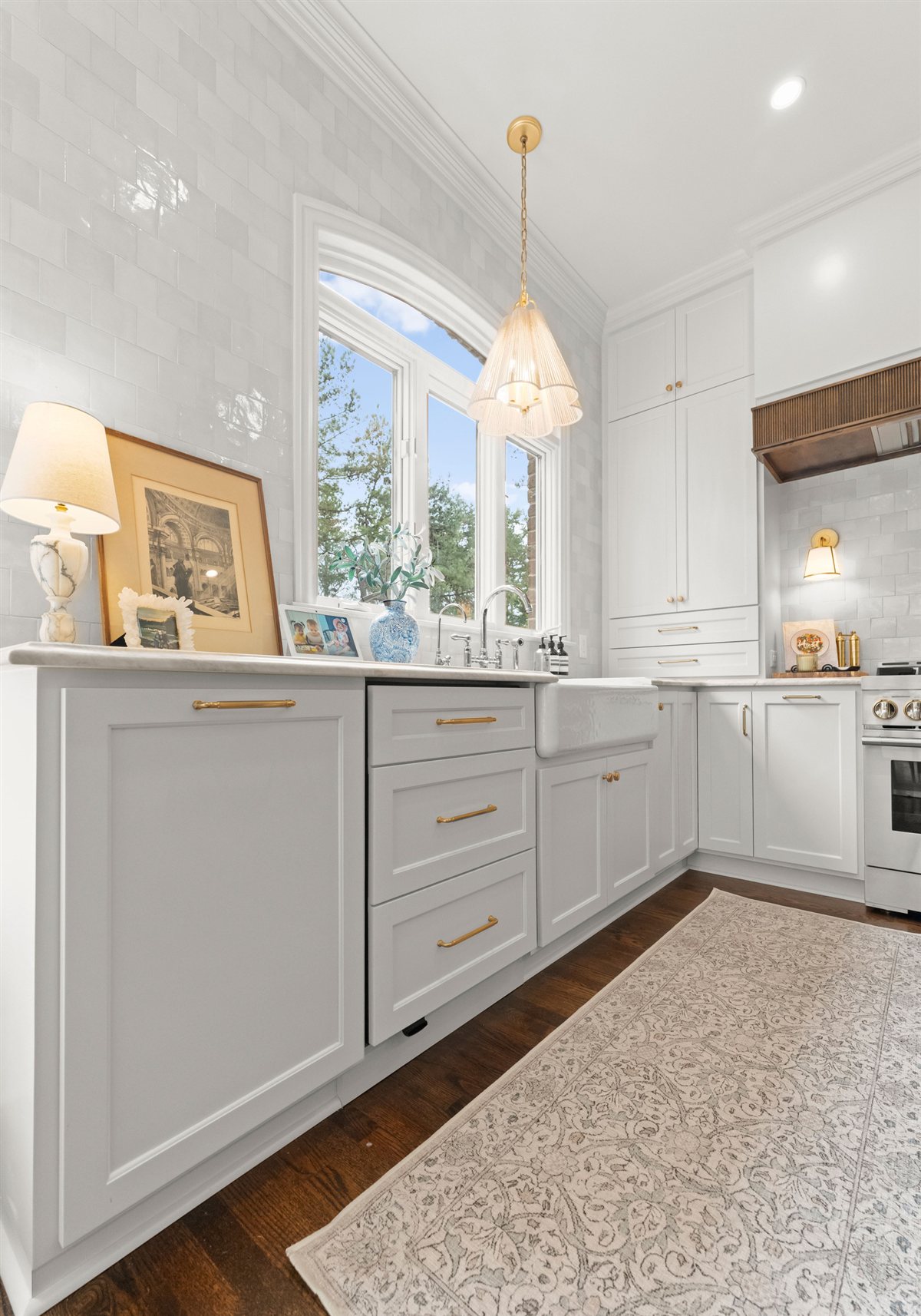 Kitchen with white cabinetry and a pendant light, The Point renovation