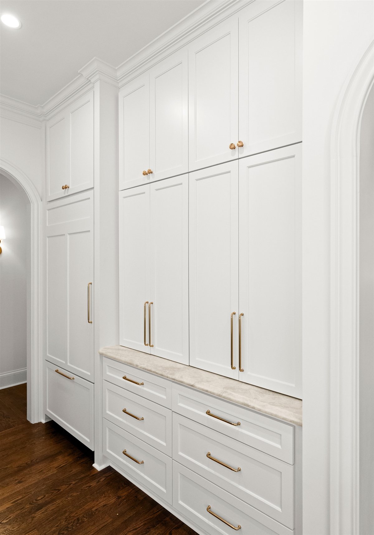 White built-in cabinetry with brass pulls, The Point renovation
